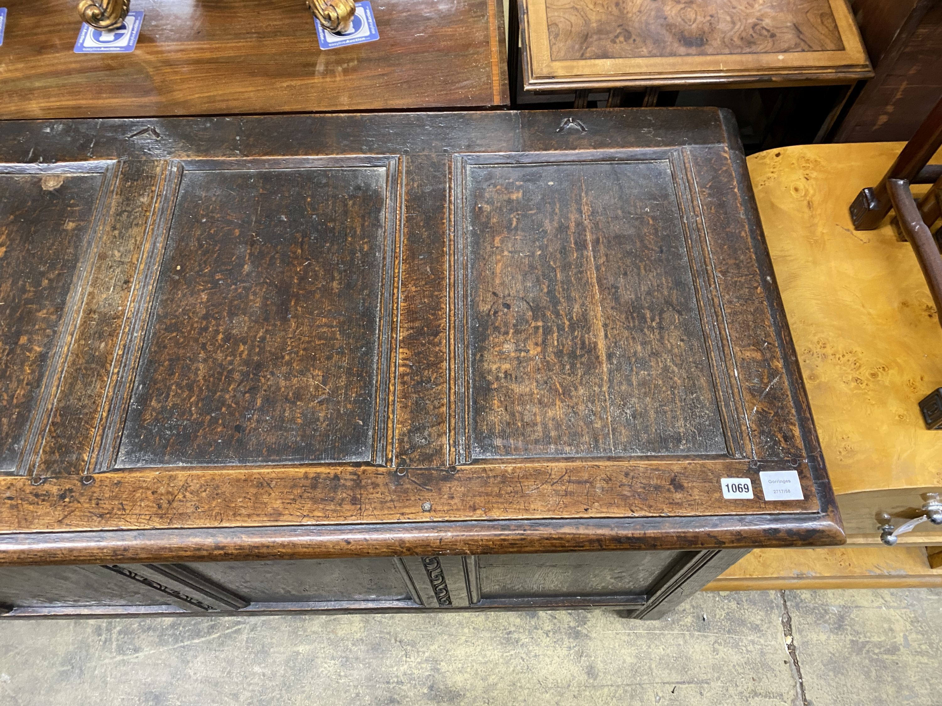 An 18th century panelled oak coffer, length 168cm, depth 63cm, height 75cm